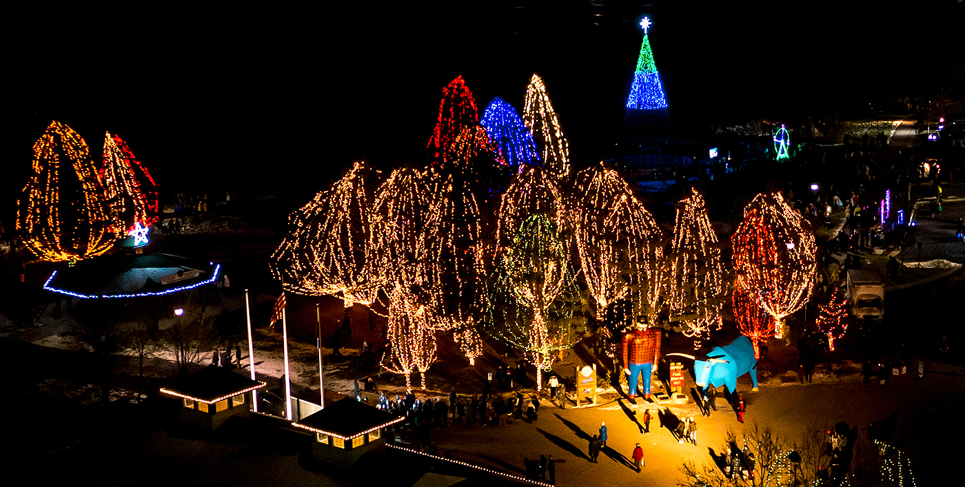 Ariel shot of Paul Bunyan park illuminated with Christmas lights.